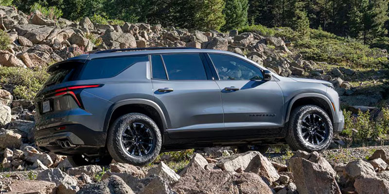 Gray Chevrolet Traverse on rocky terrain